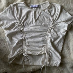 cream/white adika L crop tie top, worn once